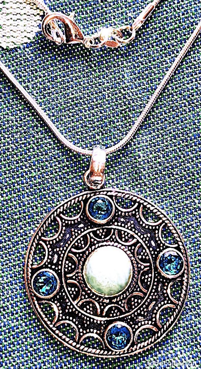 Joyeria: Colgante de Plata con Piedras Larimar ,Topacios y Cadena de plata.