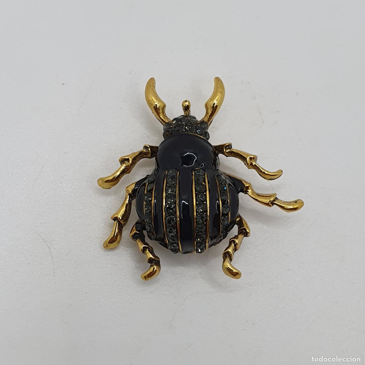 Joyeria: Magn&iacute;fico broche de insecto de dise&ntilde;o art dec&oacute;, con acabados en oro, esmalte y pedrer&iacute;a negra.