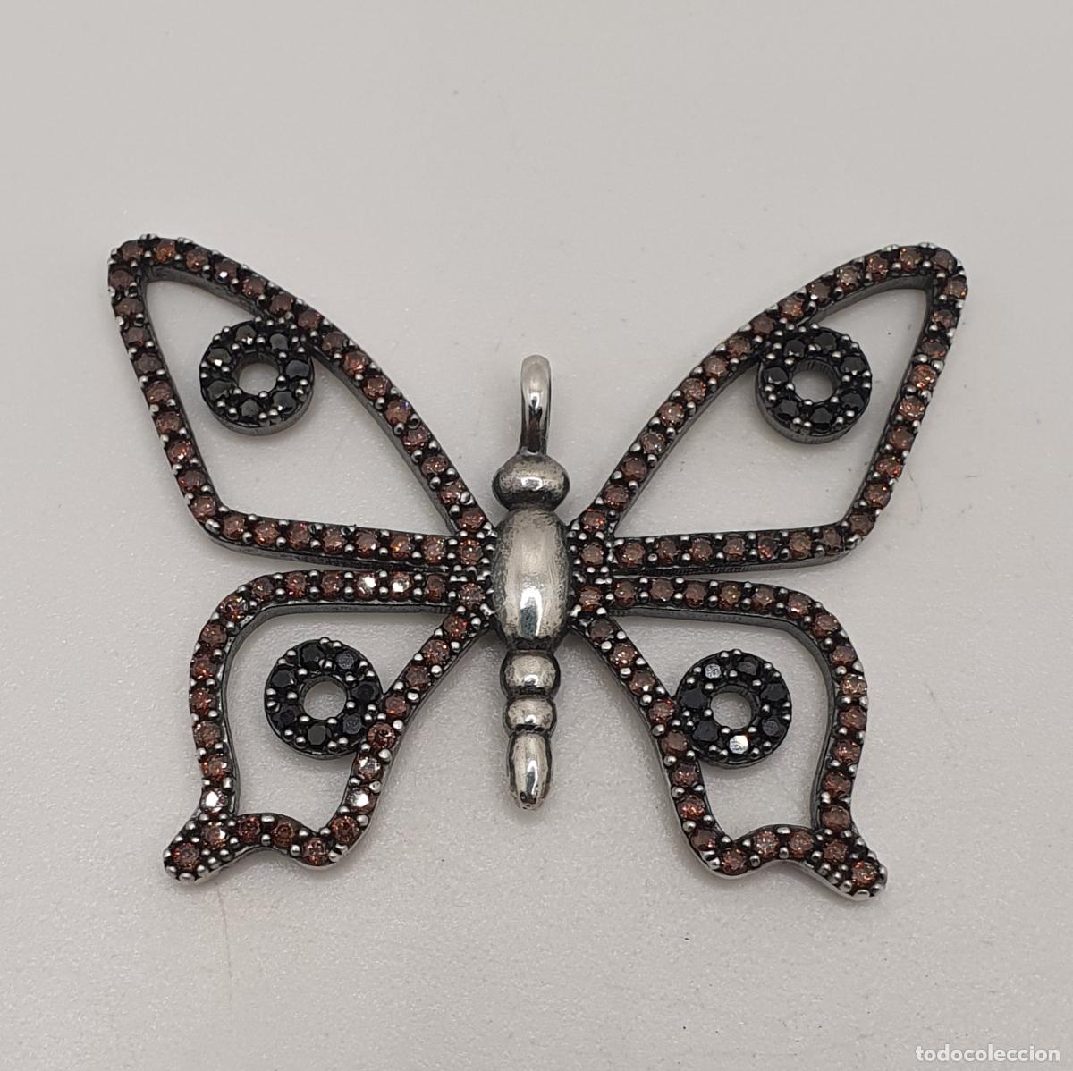 Joyeria: Maravilloso colgante de mariposa en plata de ley 925 con turmalinas y granates talla brillante.