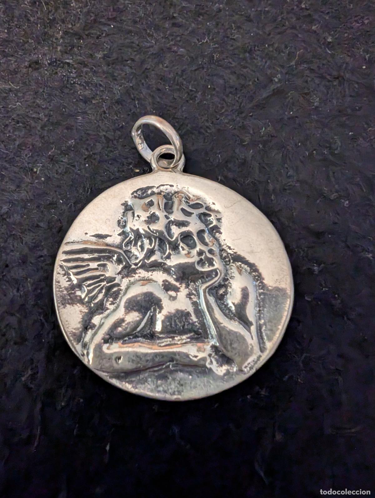 Joyeria: ANGEL O QUERUBIN DE RAFAEL. RENACENTISTA. ANGEL E LA GUARDA. DE PLATA. 7,30 gr. Y MIDE 31,50 mm