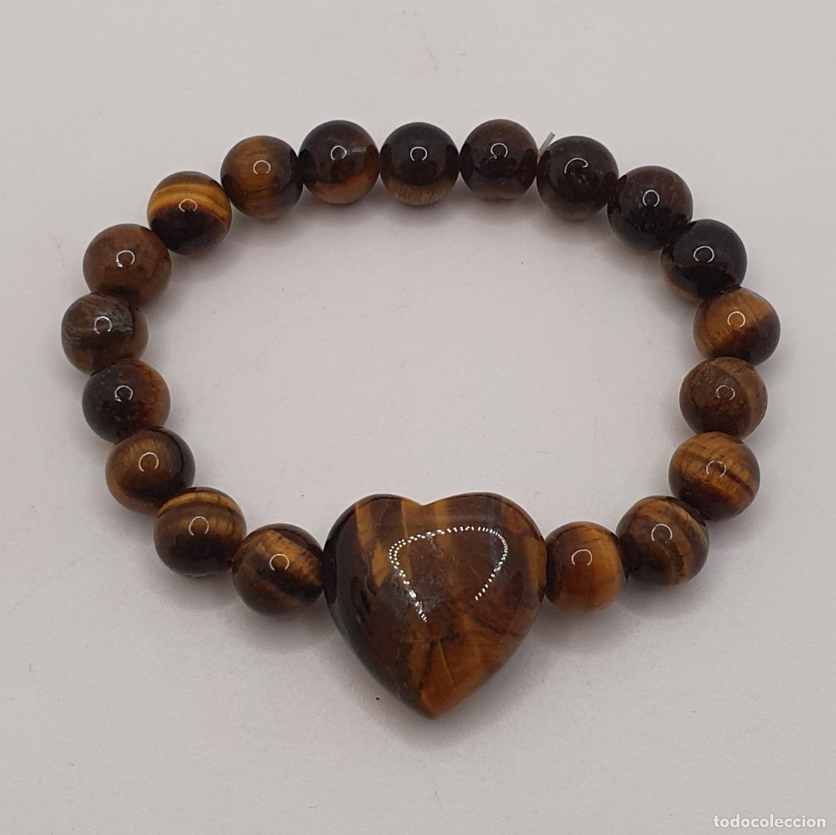 Joyeria: Excelente pulsera de esferas de ojo de tigre aut&eacute;ntico con bello coraz&oacute;n central, piedra protectora.