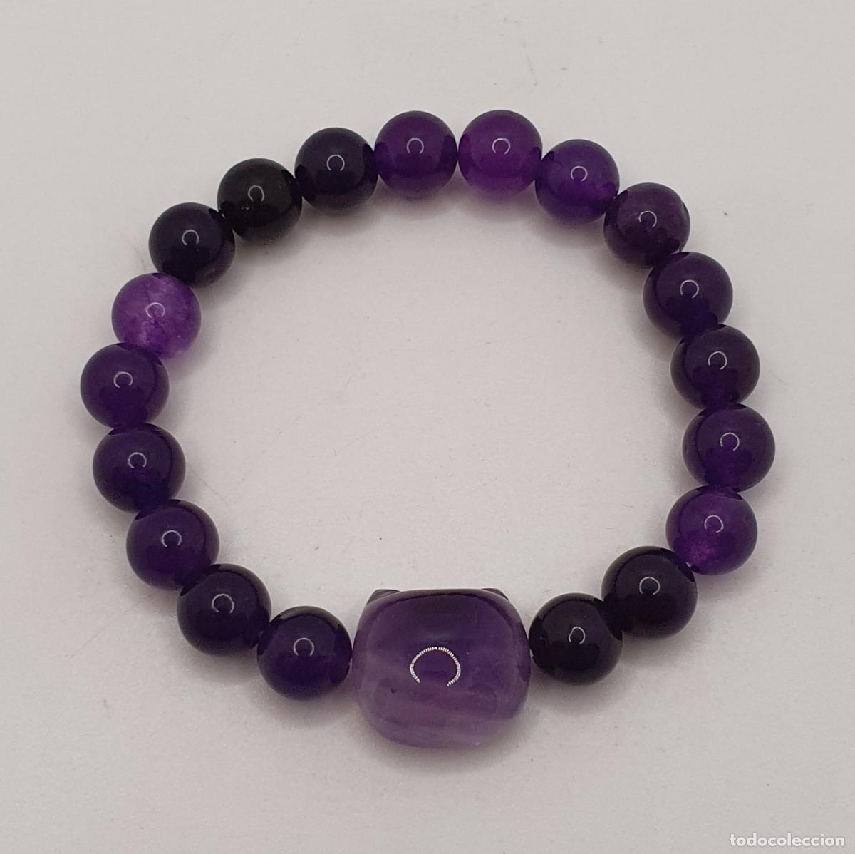 Joyeria: Bella pulsera en esferas de amatista aut&eacute;ntica con cara de gato, piedra de protecci&oacute;n y calma.