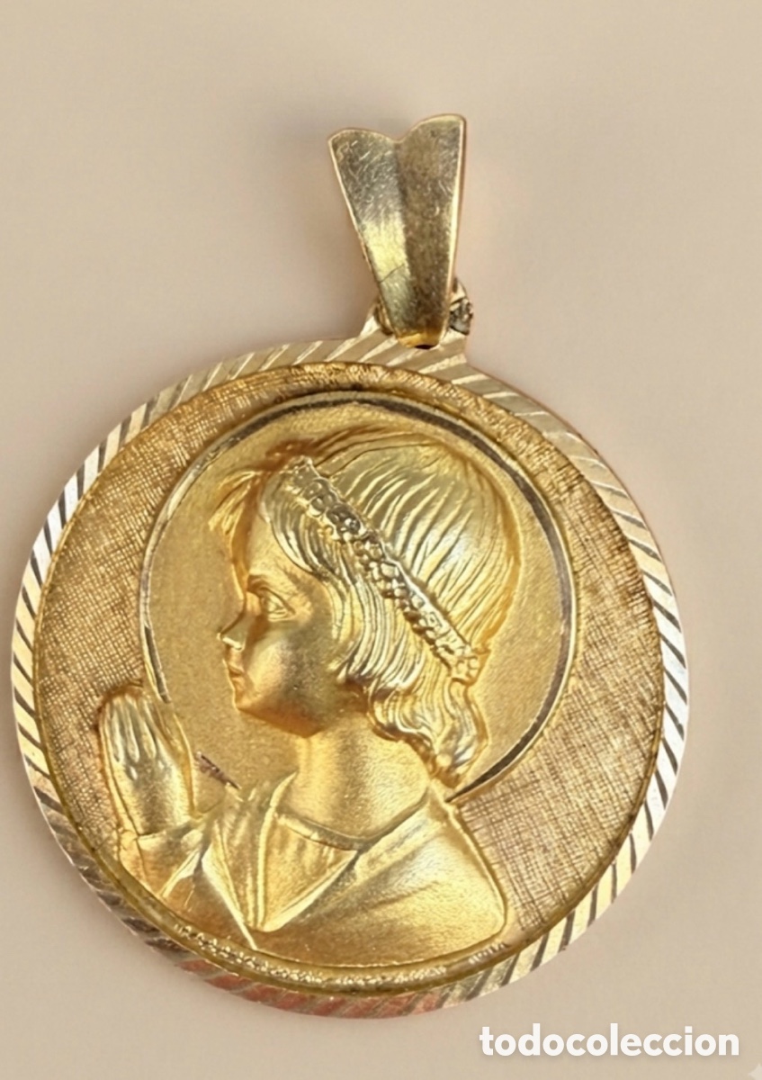 Joyeria: Medalla de oro de 18 k , peso 9.5 gramos