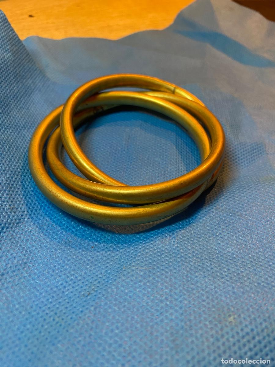 Joyeria: Tres pulseras entrelazadas