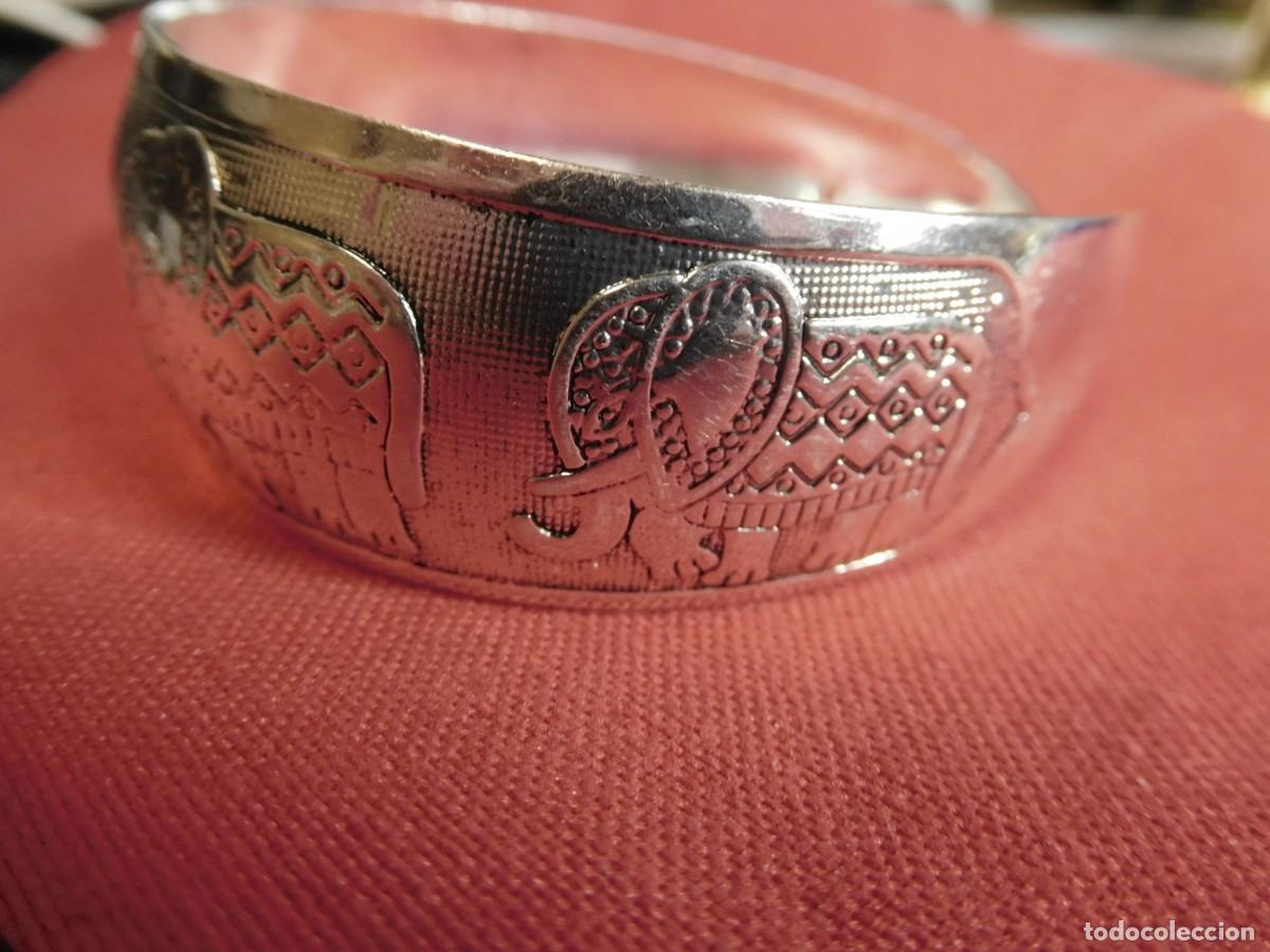 Joyeria: Pulsera de plata, ley 925, ancha, adornada con motivos animales