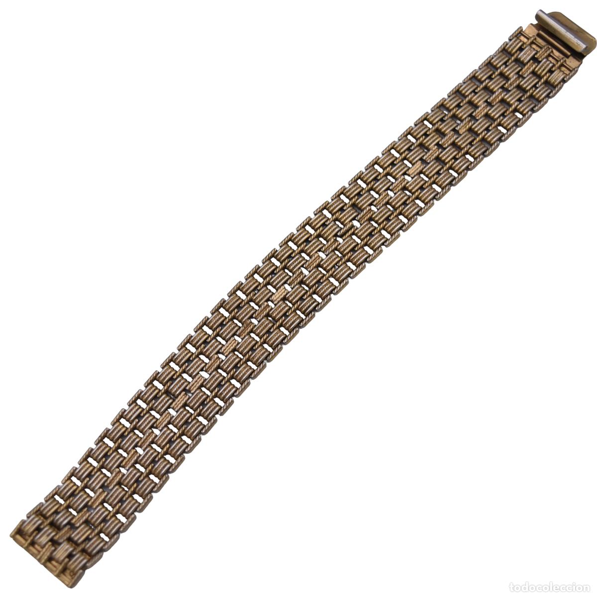 Joalharia: Pulsera de metal dorado
