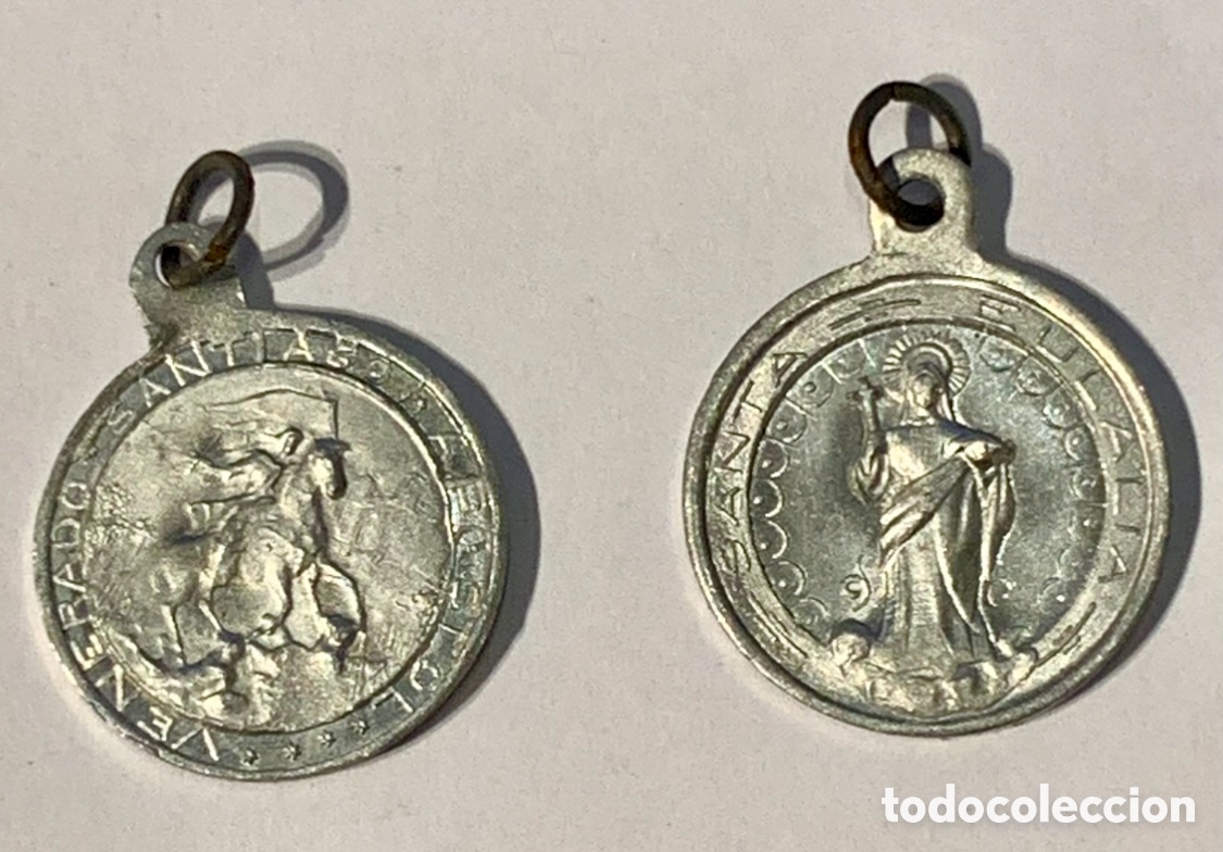 Joyeria: Colgante / Medalla. Santa Eulalia. Santiago Ap&oacute;stol. Aluminio. A&ntilde;os 60.