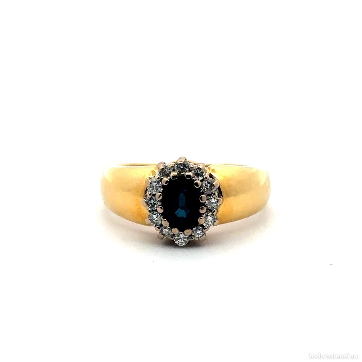 Gioielleria: Anillo de Oro Amarillo con Zafiro y Halo de Diamantes