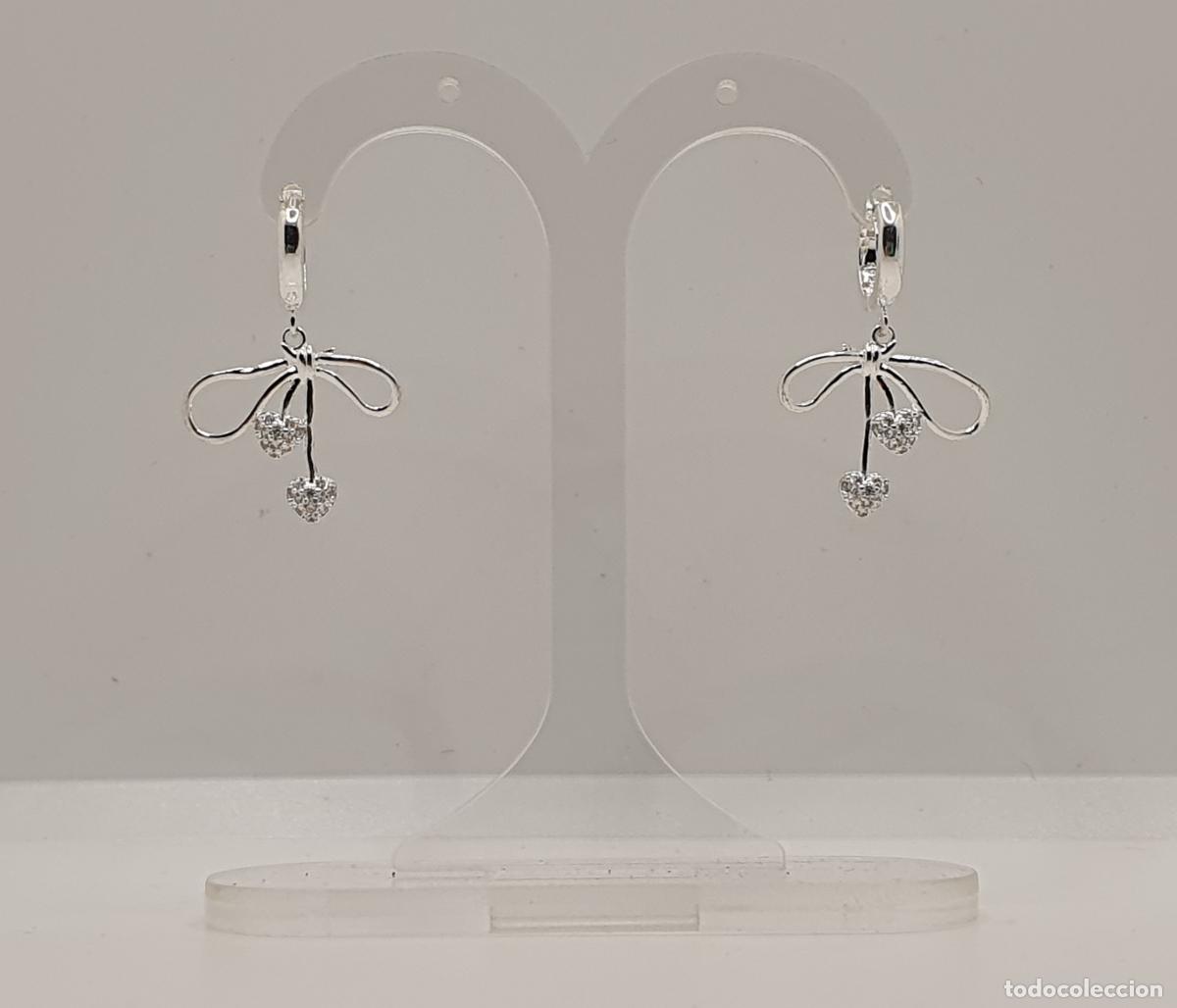 Joyeria: Deliciosos pendientes de dise&ntilde;o lazo chapados en plata de ley con corazones cuajados de circonitas.