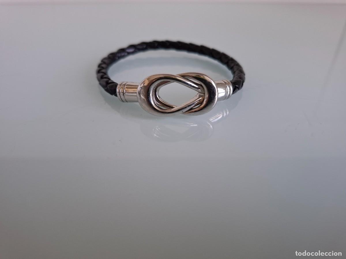 Joyeria: PULSERA DE CUERO TRENZADO DE COLOR NEGRO - CIERRE DE METAL PLATEADO CON FORMA DE LAZO
