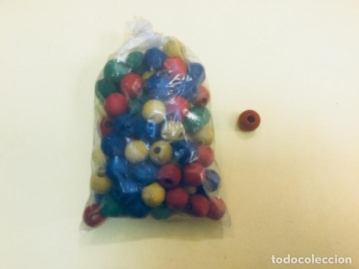 Juegos antiguos: Bolsa con 100 bolas de madera. &Oslash; 1,4 cms. - Foto 1