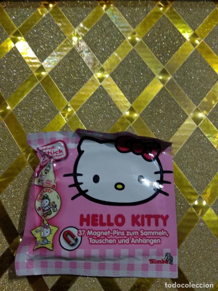 Juegos antiguos: Im&aacute;n y pulsera de Hello Kitty * - Foto 1