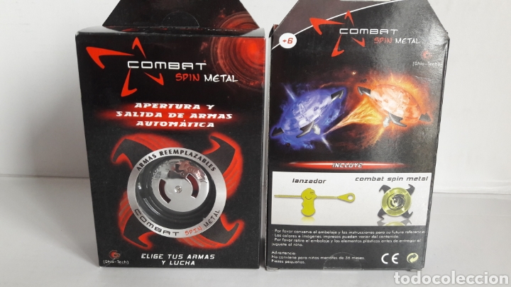 Juegos antiguos: 2 peonzas Combat spin metal - Foto 1