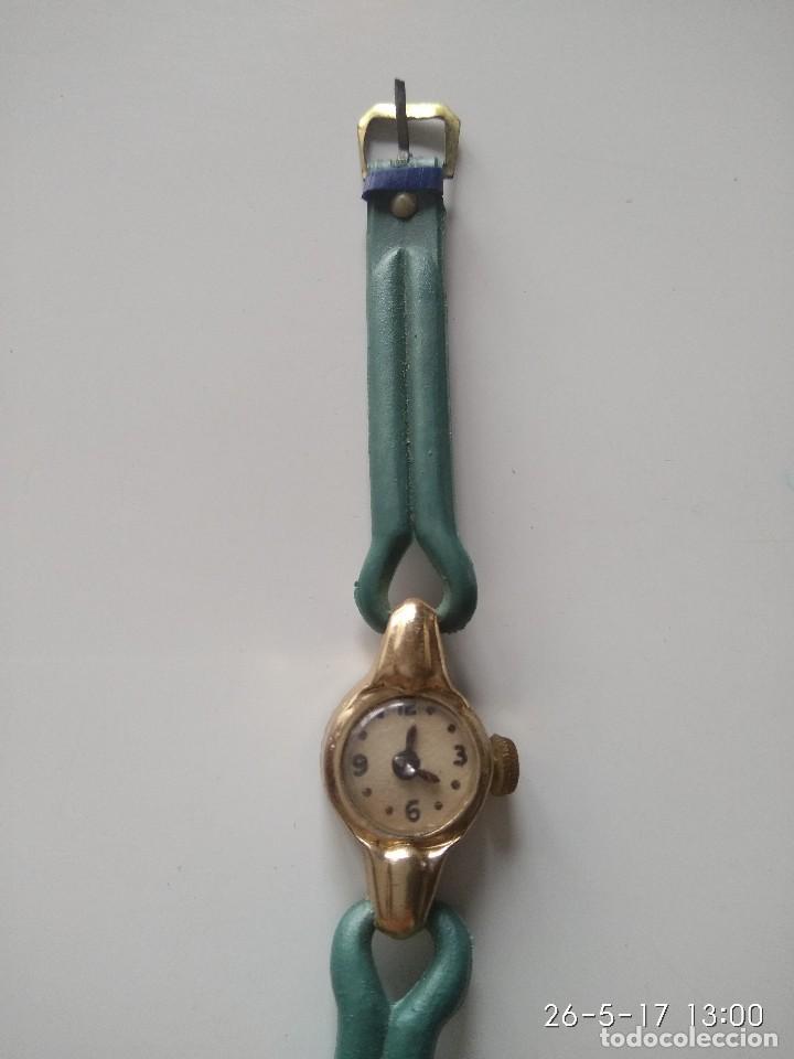 Juguetes antiguos y Juegos de colecci&oacute;n: Antiguo reloj de juguete de Kiosko. Hojalata y pl&aacute;stico.
