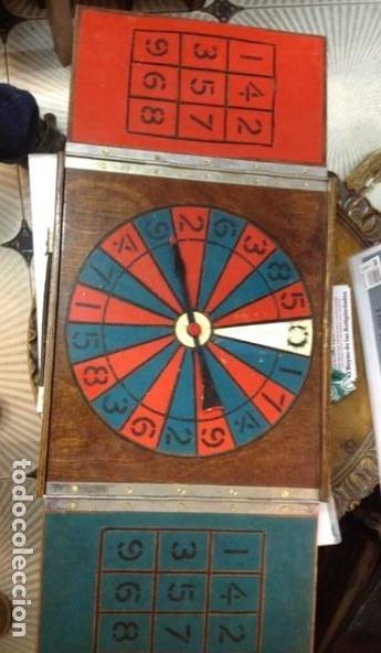 Juguetes antiguos y Juegos de colecci&oacute;n: Ruleta viajante trilero. Maleta de madera con llave . sistema ARTESANAL en lat&oacute;n. Original de &eacute;poca.