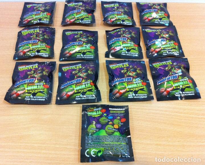 Juguetes antiguos y Juegos de colecci&oacute;n: LOTE DE 12 + 1 SOBRES CERRADOS DE LANZA DISCOS - TORTUGAS NINJA / TMNT, DE PHOSKITOS (2014)