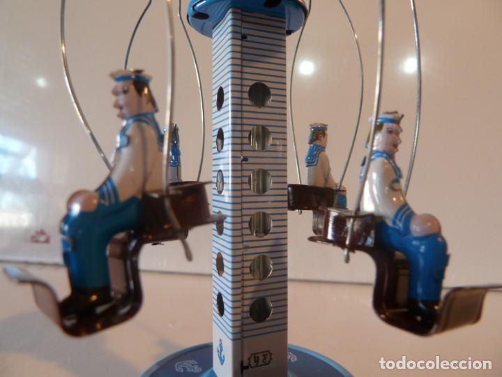 Juguetes antiguos y juegos de colecci&oacute;n: CURIOSO TIOVIVO CARRUSEL JUGUETE HOJALATA TIO VIVO