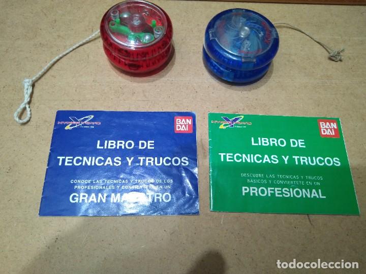 Juguetes antiguos y Juegos de colecci&oacute;n: Lote 813. 2 Yo-Yos, con libros de instrucciones, para gran maestro y para profesional