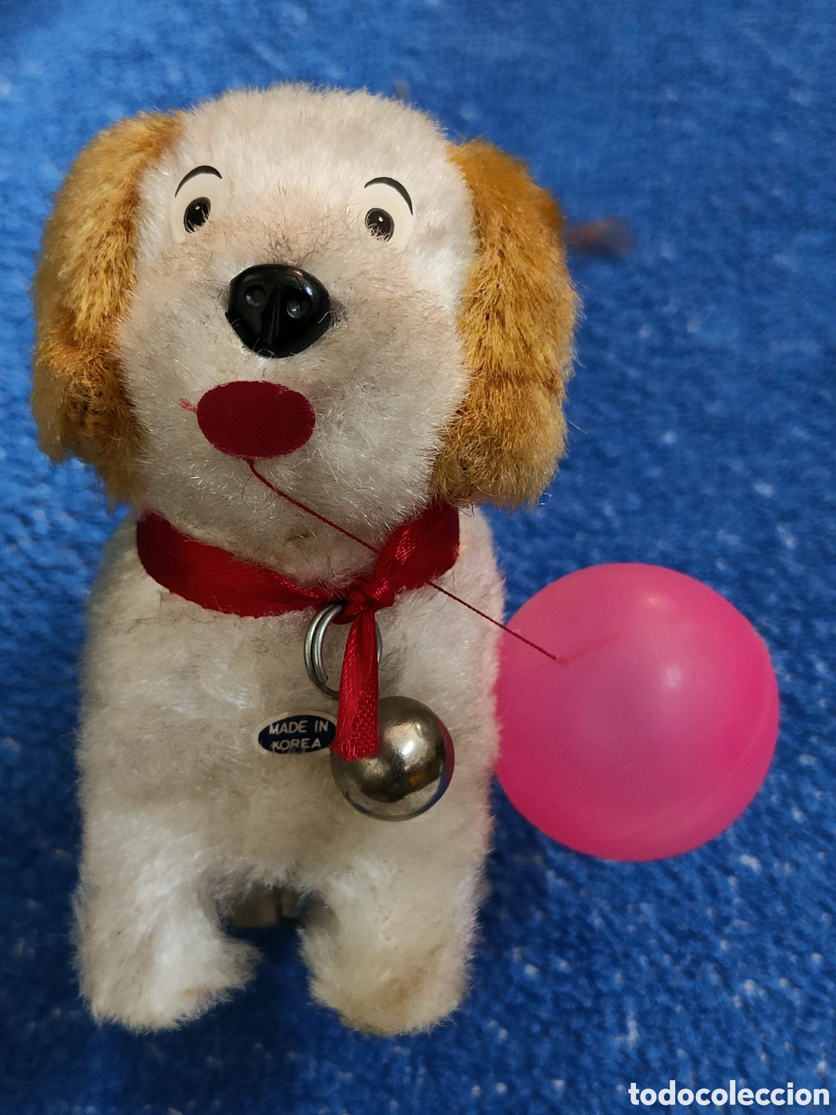 Altes Spielzeug und Spiele: Perro de cuerda jugando con pilota