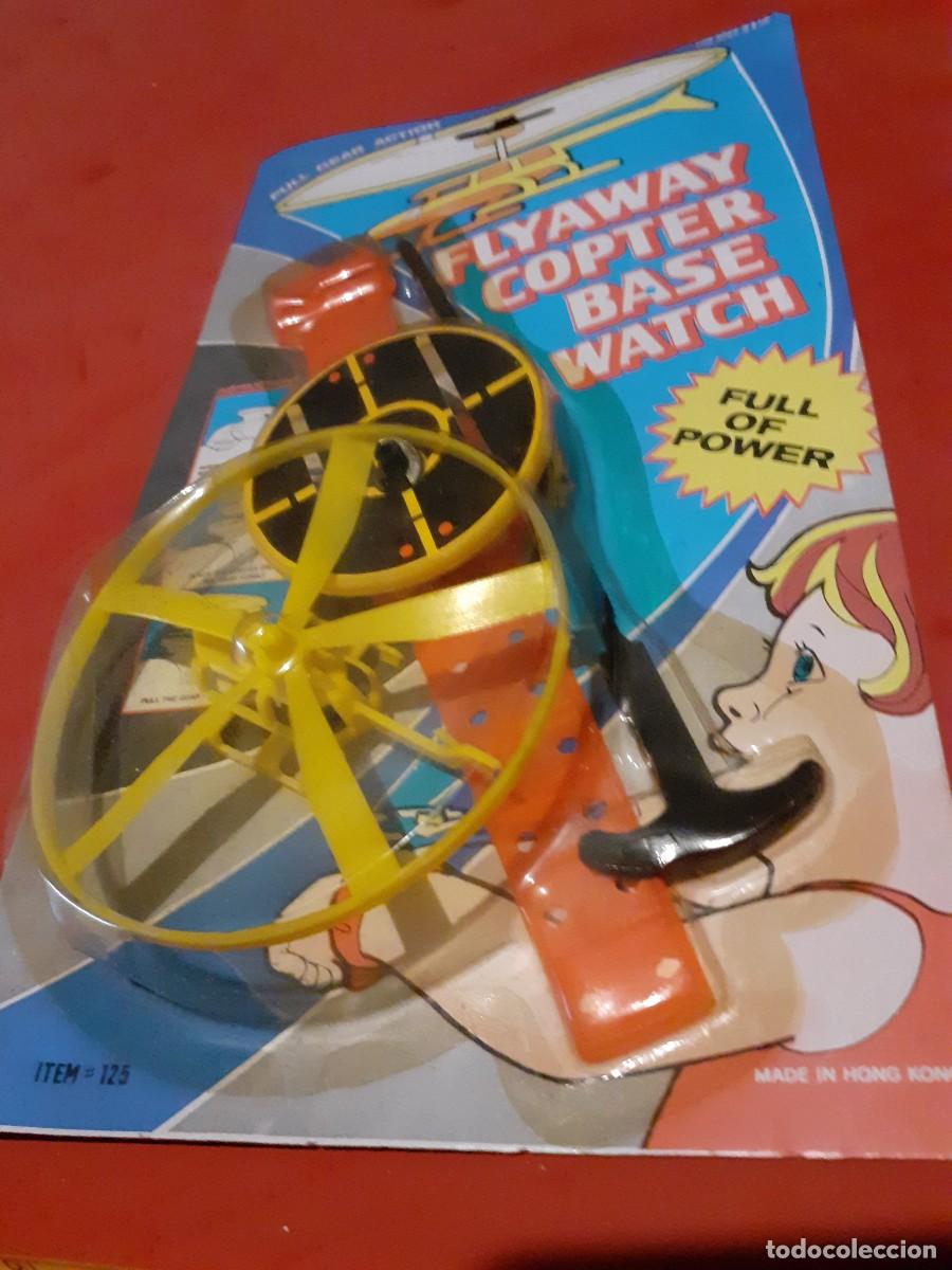 Juguetes antiguos y Juegos de colecci&oacute;n: RELOJ LANZA HELICOPTERO A&Ntilde;OS 80 A ESTRENAR*