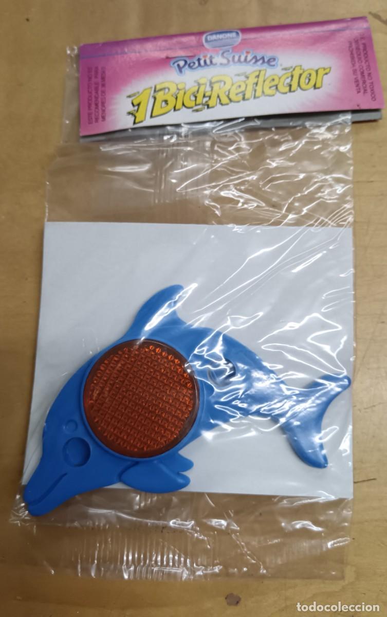 Juguetes antiguos y Juegos de colecci&oacute;n: BICI-REFLECTOR DELF&Iacute;N AZUL PETIT SUISSE DANONE SIN ABRIR