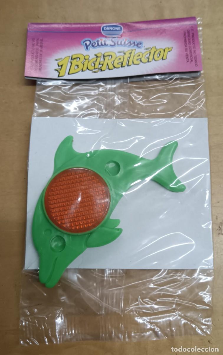 Juguetes antiguos y Juegos de colecci&oacute;n: BICI-REFLECTOR DELF&Iacute;N VERDE PETIT SUISSE DANONE SIN ABRIR