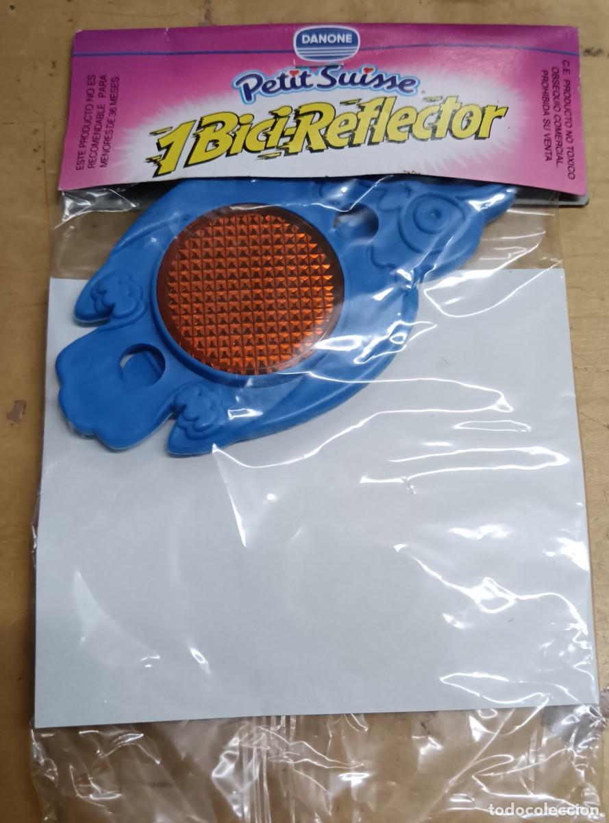 Juguetes antiguos y Juegos de colecci&oacute;n: BICI-REFLECTOR B&Uacute;HO AZUL PETIT SUISSE DANONE SIN ABRIR
