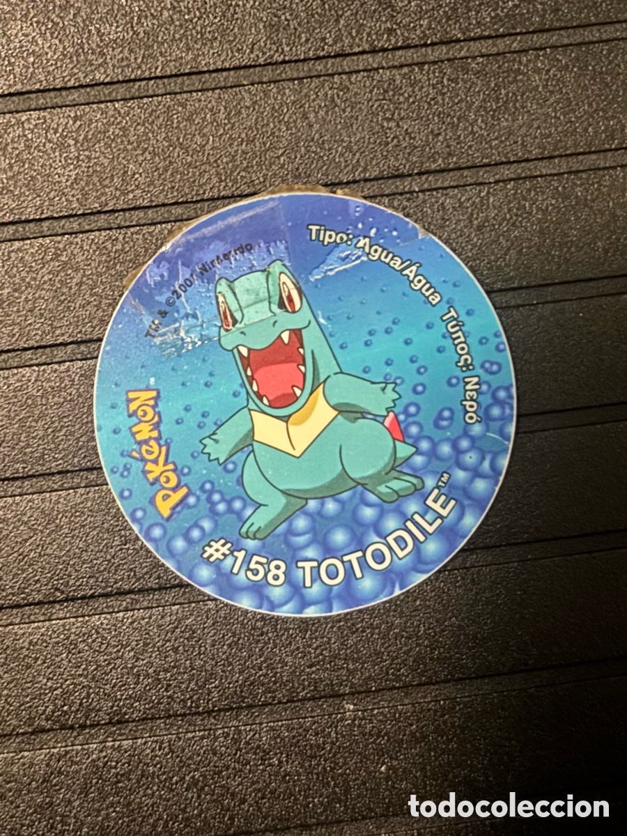 Juguetes antiguos y Juegos de colecci&oacute;n: Mega tazo totodile con algo de cinta, Pokemon