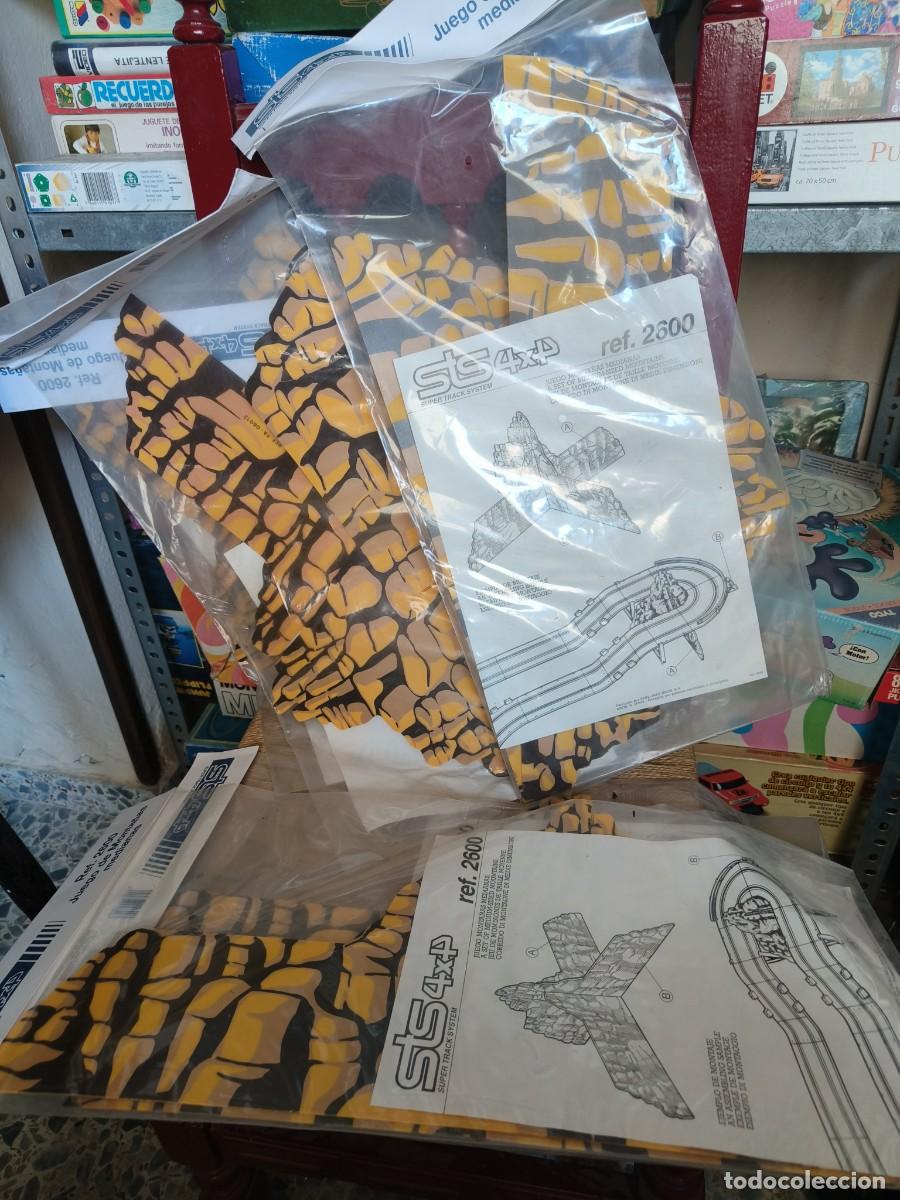 Juguetes antiguos y Juegos de colecci&oacute;n: Ocasion ! 5 bolsas precintadas sin abrir Juego monta&ntilde;as medias Sclaextric Sts 4x4 ref. 2600