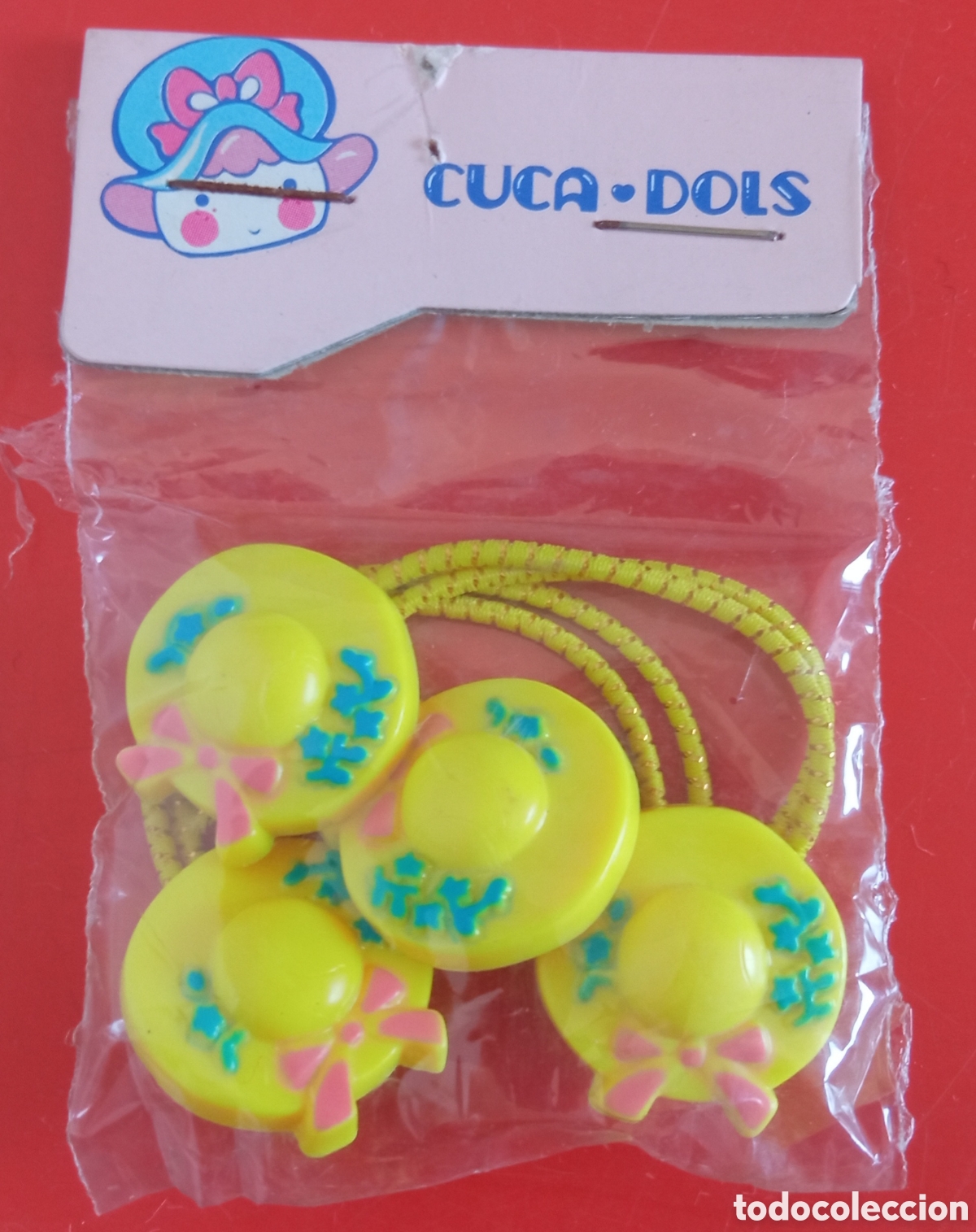Juguetes antiguos y Juegos de colecci&oacute;n: COLETEROS SOMBRERITOS AMARILLOS CUCA-DOLS.JUYPAL 80'S.BOLSITA SIN ABRIR.