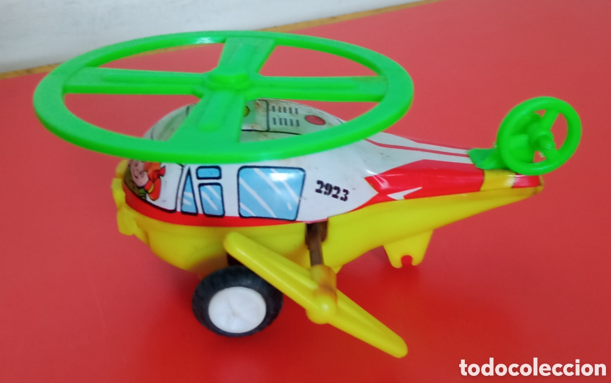 Juguetes antiguos y juegos de colecci&oacute;n: HELIC&Oacute;PTERO A CUERDA RESORTE CON GIRO.IMPORTACI&Oacute;N HONG KONG 80'S.NUEVO.