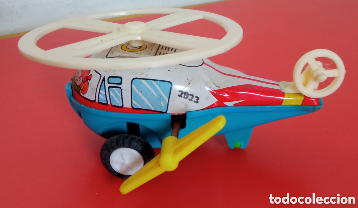Juguetes antiguos y juegos de colecci&oacute;n: HELIC&Oacute;PTERO A CUERDA RESORTE CON GIRO.IMPORTACI&Oacute;N HONG KONG 80'S.NUEVO.