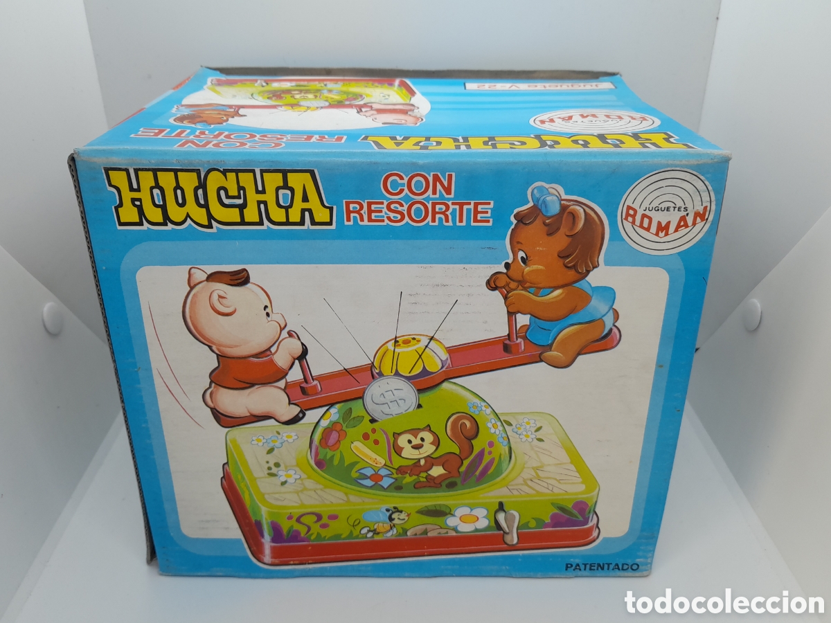 Juguetes antiguos y juegos de colecci&oacute;n: ANTIGUA HUCHA DE ROMAN. CON RESORTE. SERIE MAGICOS RESORTES. SIN USAR