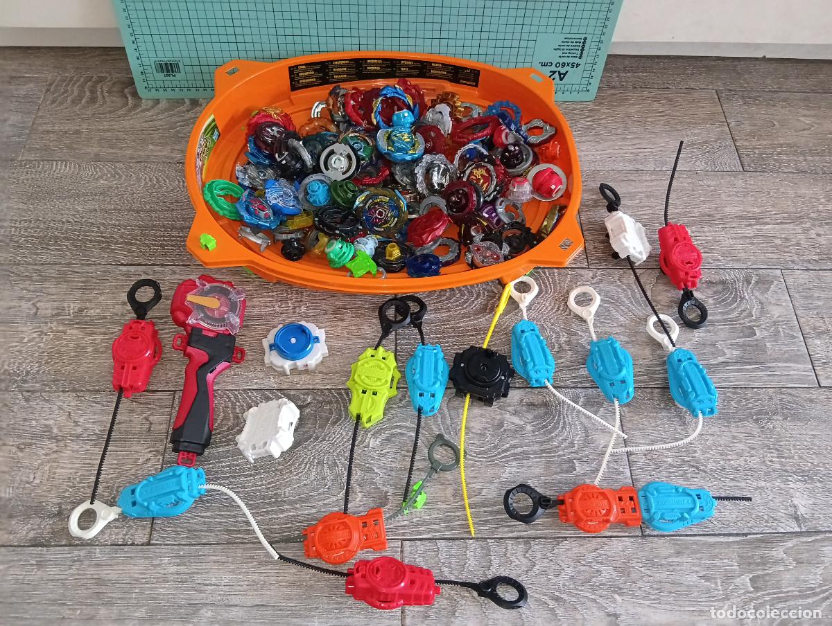 Giocattoli antichi e Giochi di collezione: Gran lote Beyblade Burst Estadio lanzadores peonzas y piezas variadas Bey Blade
