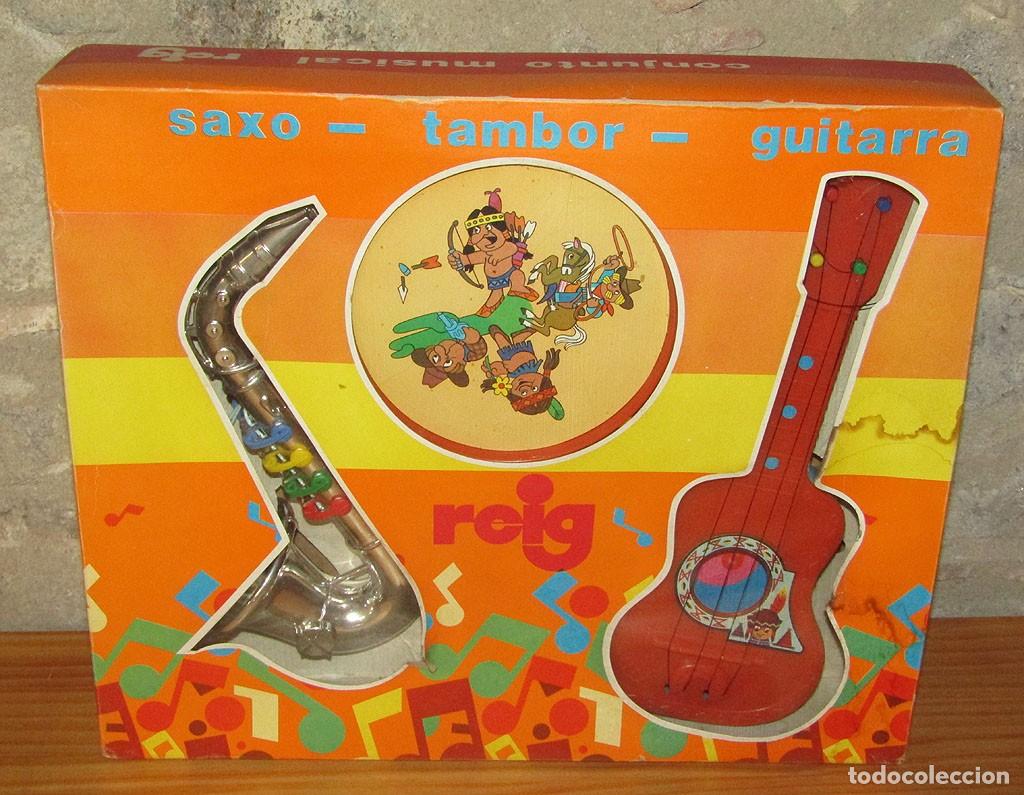 Juguetes antiguos y juegos de colecci&oacute;n: ANTIGUO CONJUNTO MUSICAL DE REIG: GUITARRA, TAMBOR Y SAXO - NUEVO Y EN SU CAJA - A&Ntilde;OS 70