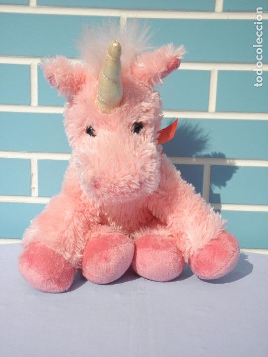 unicornio rosa de peluche