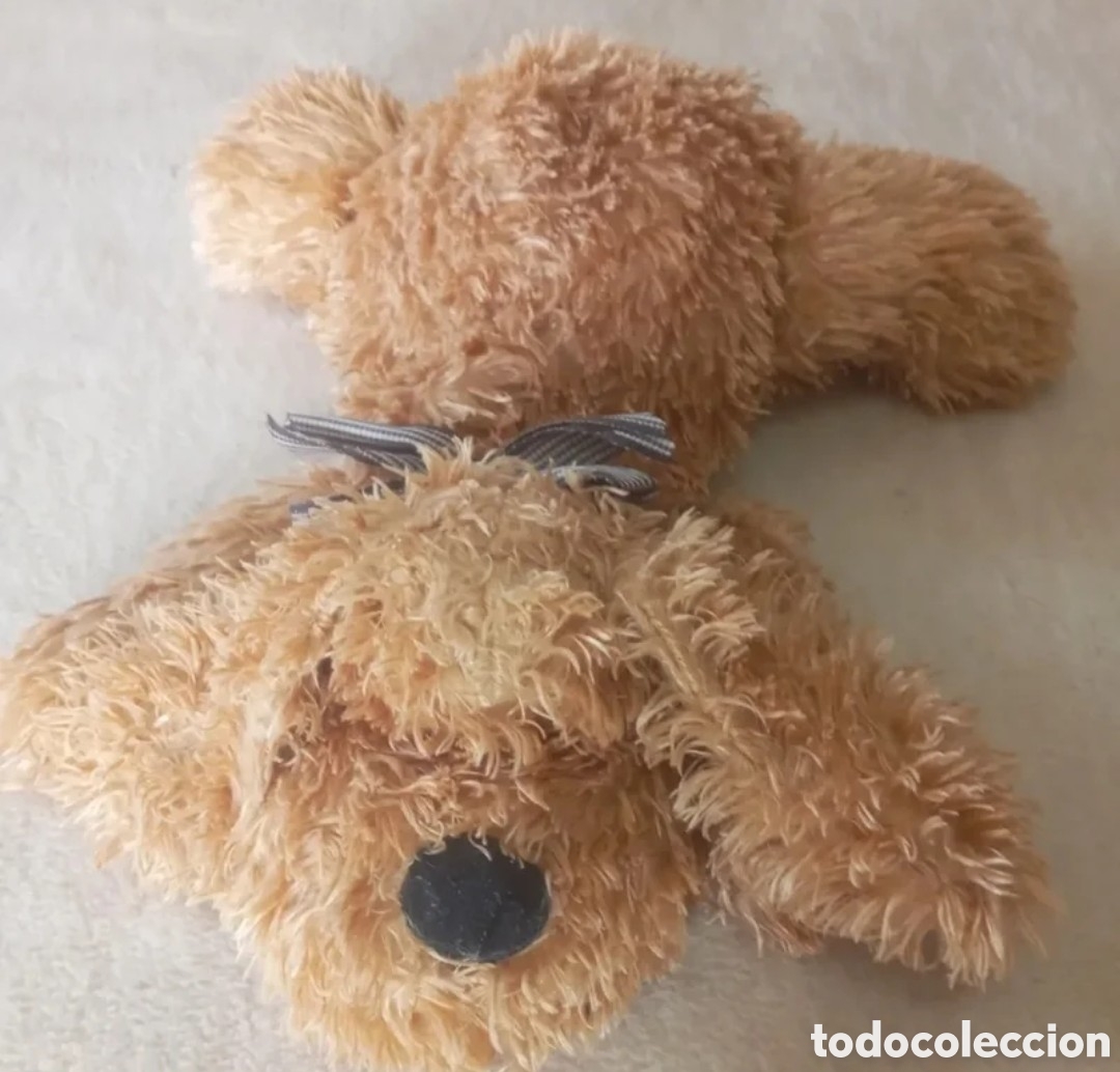 Juguetes antiguos: Perro de peluche marr&oacute;n.