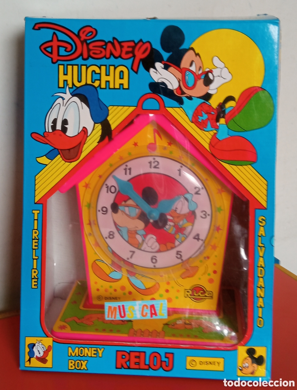 Juguetes antiguos Rico: HUCHA RELOJ MUSICAL DISNEY.RICO/PROMOIBI 80'S.SIN USO,EN CAJA.NO FUNCIONA.
