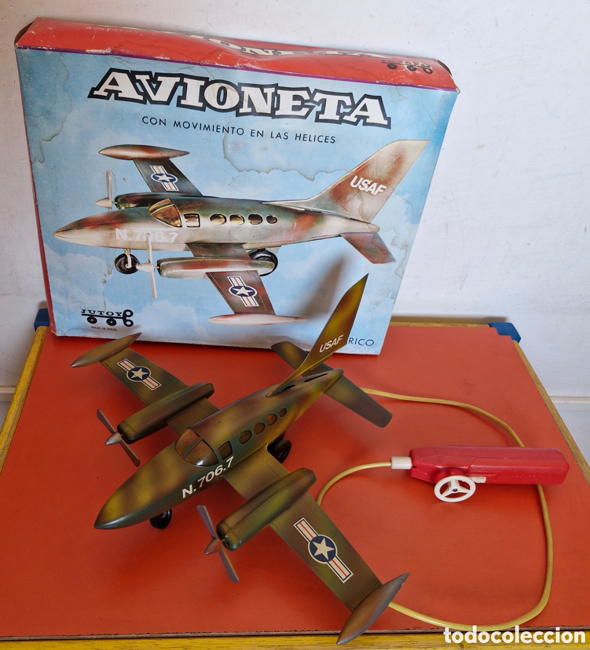 Juguetes antiguos: AVIONETA MILITAR A PILAS,DIRIGIDA CABLE.JUTOY 70'S.NUEVA EN CAJA.