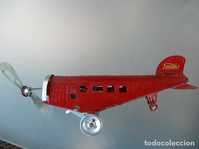 Juguetes antiguos de hojalata: Avi&oacute;n paya - Foto 3