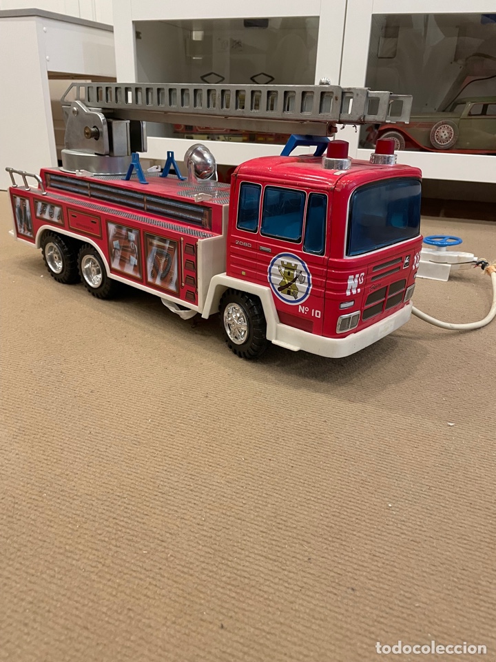 Juguetes antiguos de hojalata: Pegaso bomberos paya - Foto 2