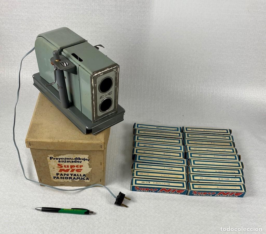 Juguetes antiguos de hojalata: Proyector dibujos animados SUPER NIC pantalla panor&aacute;mica y 18 pel&iacute;culas Original a&ntilde;os 50