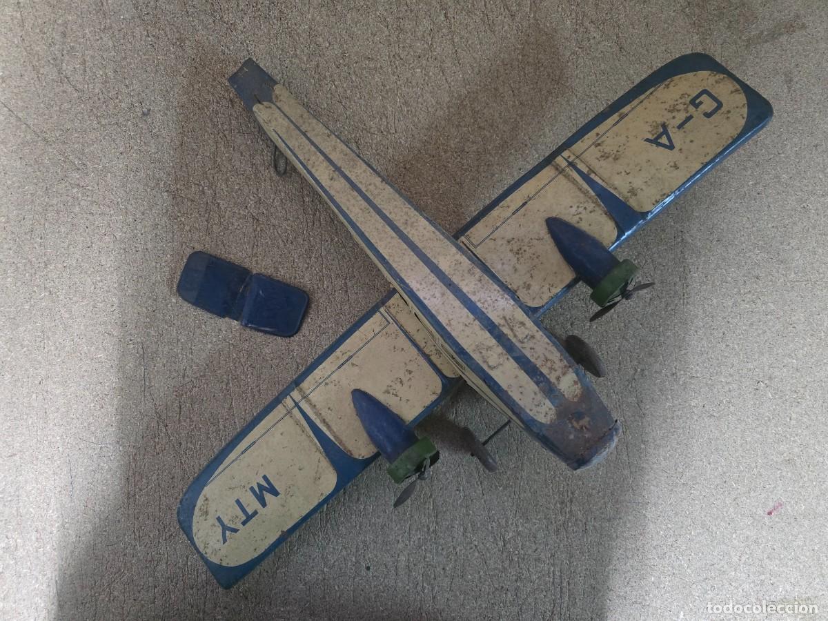 Juguetes antiguos de hojalata: Avion Helices a Cuerda (antiguo) G-A MTY.Made in England