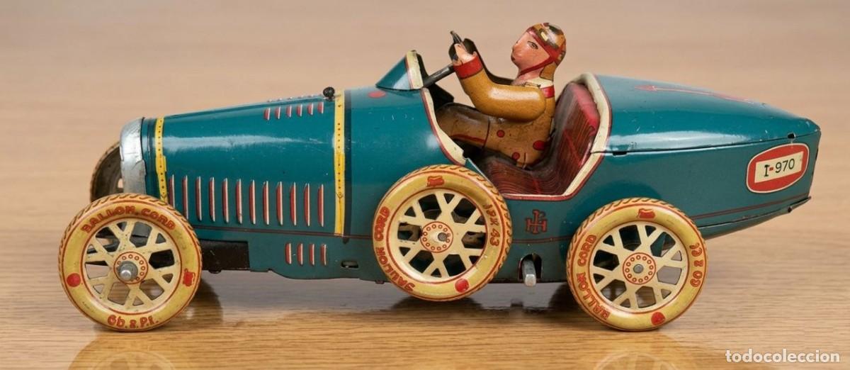 Juguetes antiguos de hojalata: Coche juguete de hojalata a cuerda