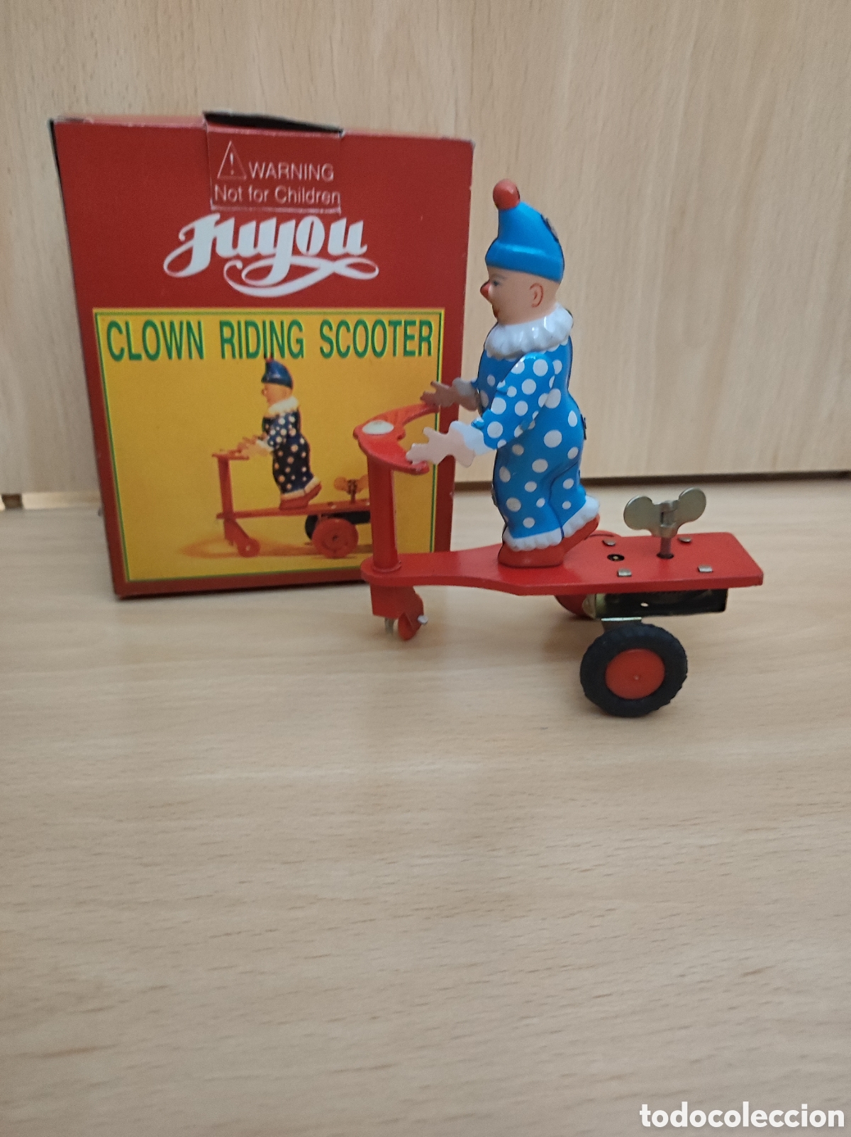 Juguetes antiguos de hojalata: Juguete Payaso triciclo a cuerda hojalata clown riding scooter