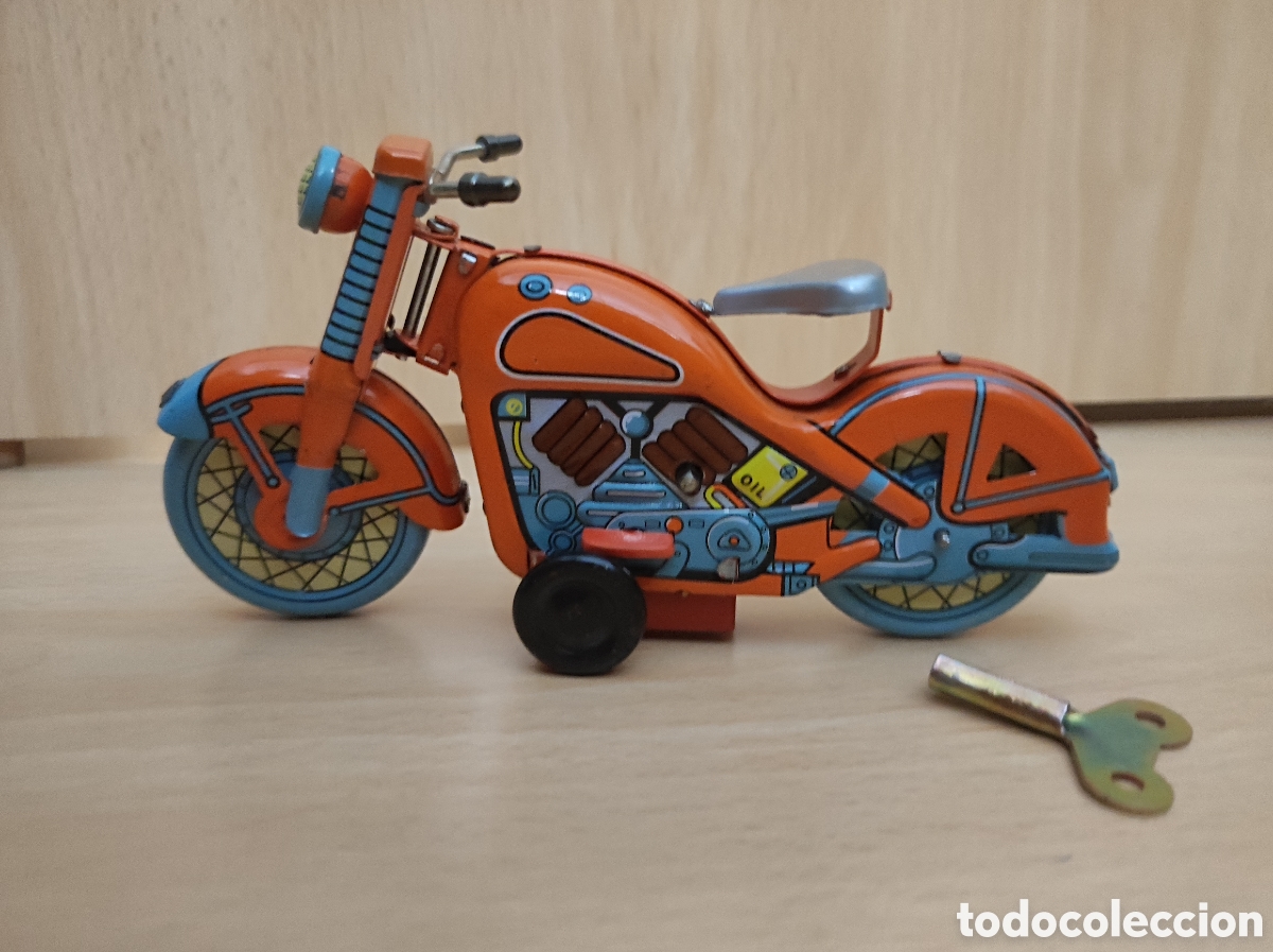 Juguetes antiguos de hojalata: Juguete moto hojalata a cuerda