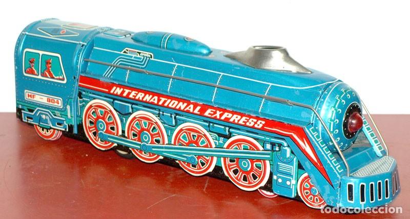 Juguetes antiguos de hojalata: Locomotora International Express - con caja - nuevo