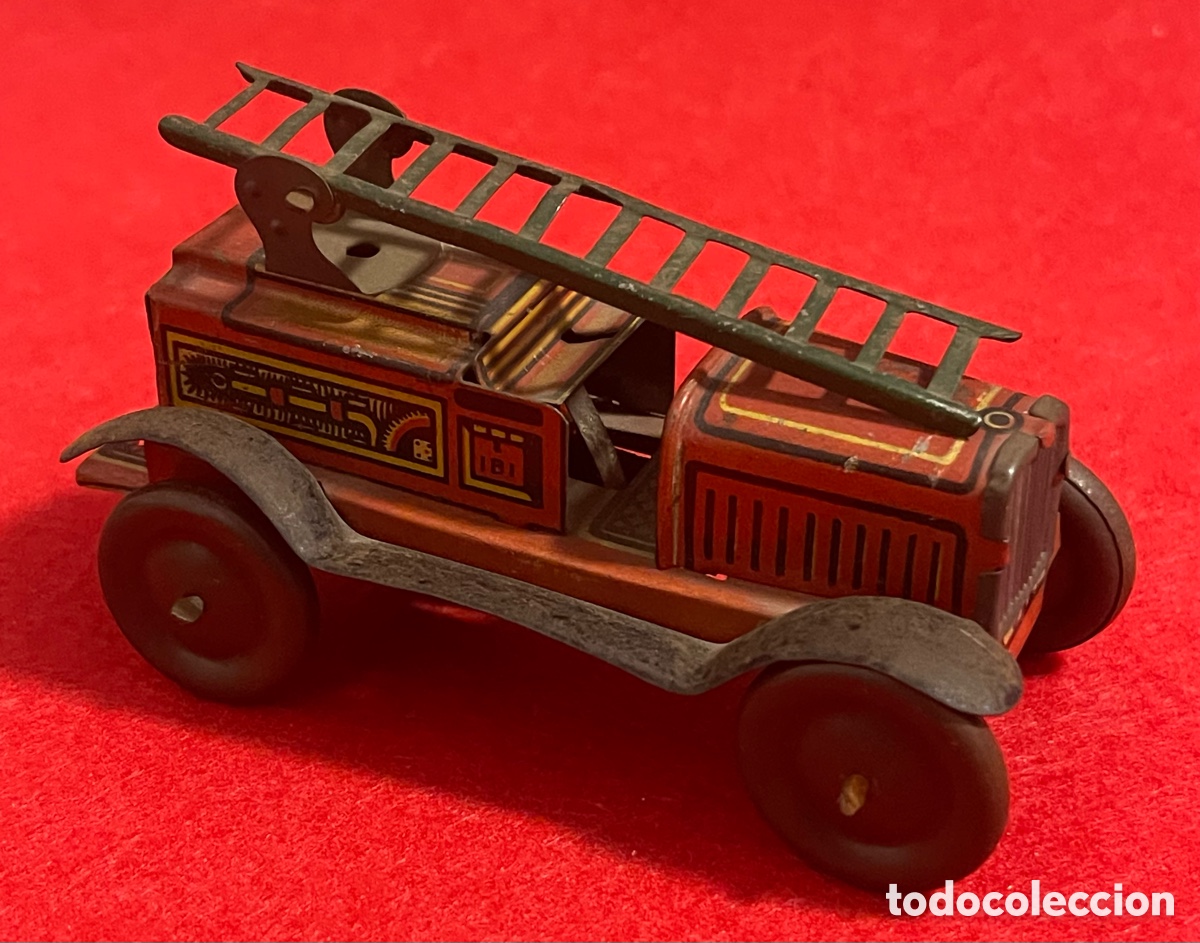 Juguetes antiguos de hojalata: Antiguo coche de bomberos, en hojalata litografiada, de la marca Rico.