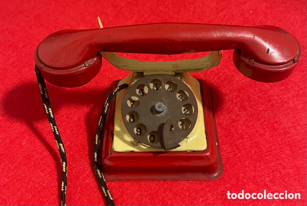 Juguetes antiguos de hojalata: Antiguo tel&eacute;fono de hojalata, litografiada, de la marca Rico