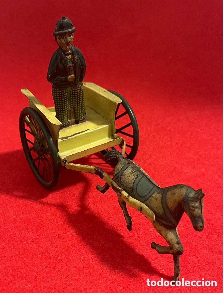 Juguetes antiguos de hojalata: Juguete de hojalata de carreta con hombre y caballo de la marca Rico